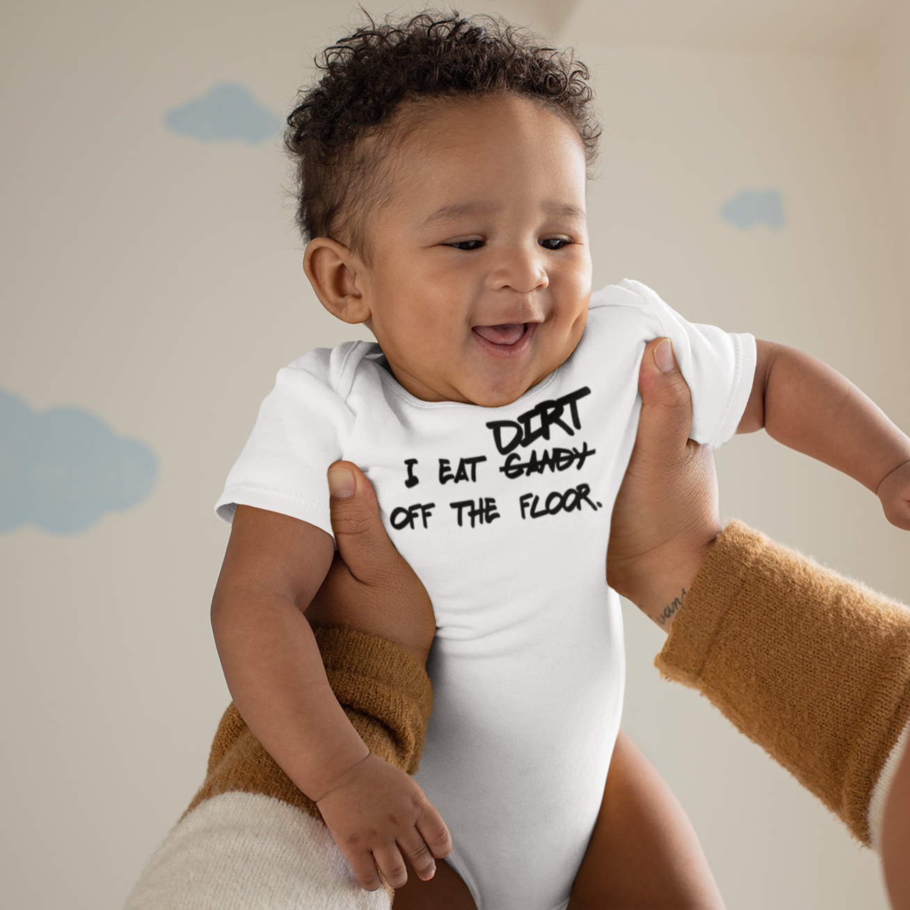 'I eat candy/dirt off the floor.' baby shortsleeve bodysuit