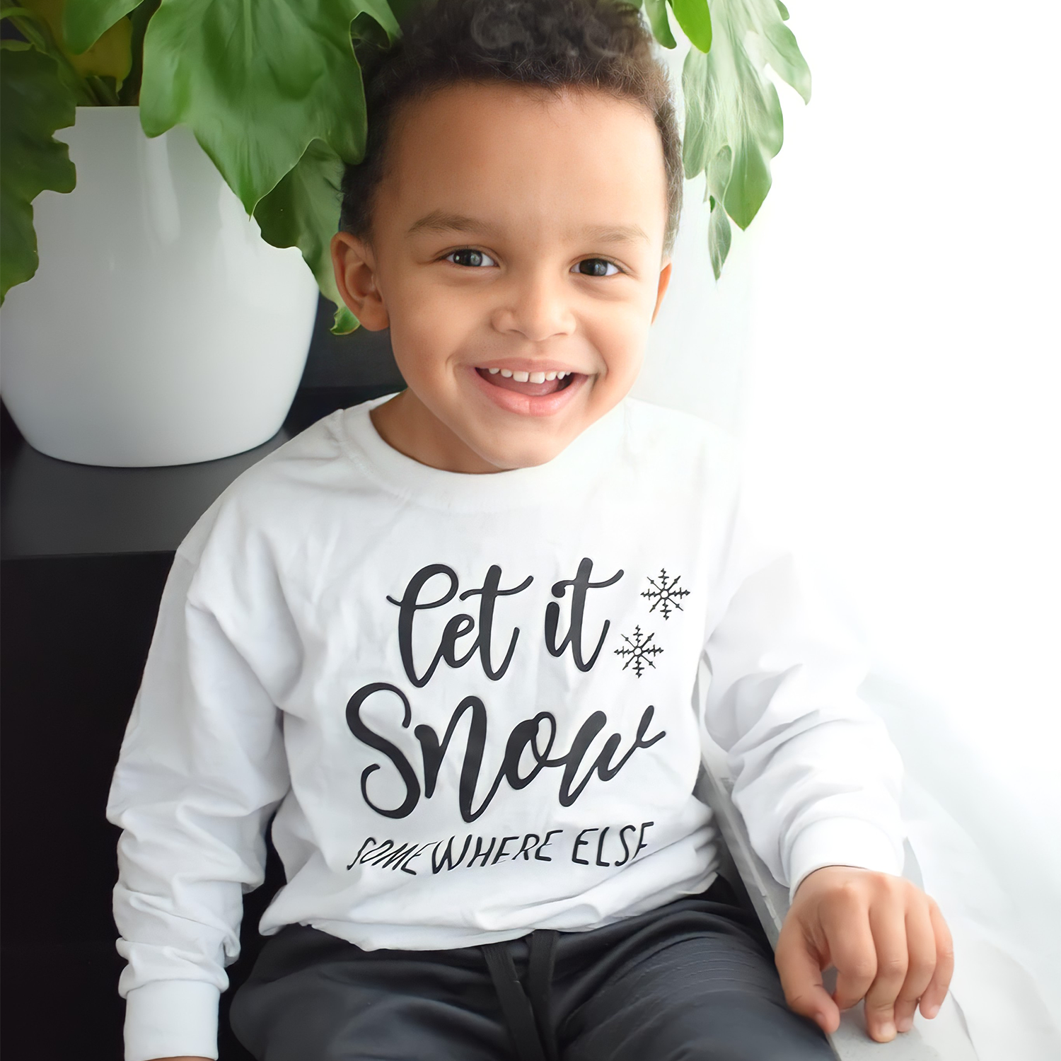 'Let it snow - somewhere else' kind shirt met lange mouwen