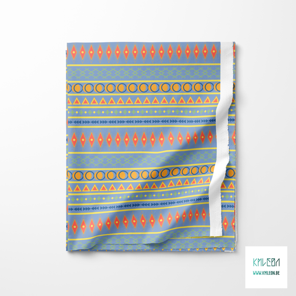 Geometric shapes in orange, blue, coral, yellow and green fabric
