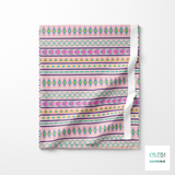 Geometric shapes in yellow, green, pink and purple fabric