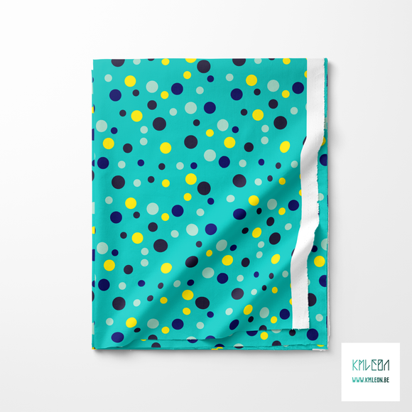 Random blue, yellow, navy and mint green polka dots fabric