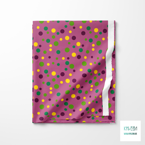 Random purple, green and yellow polka dots fabric