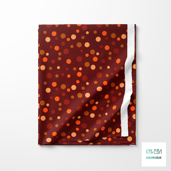 Random brown, beige and orange polka dots fabric
