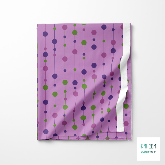 Purple and green pearls on strings fabric