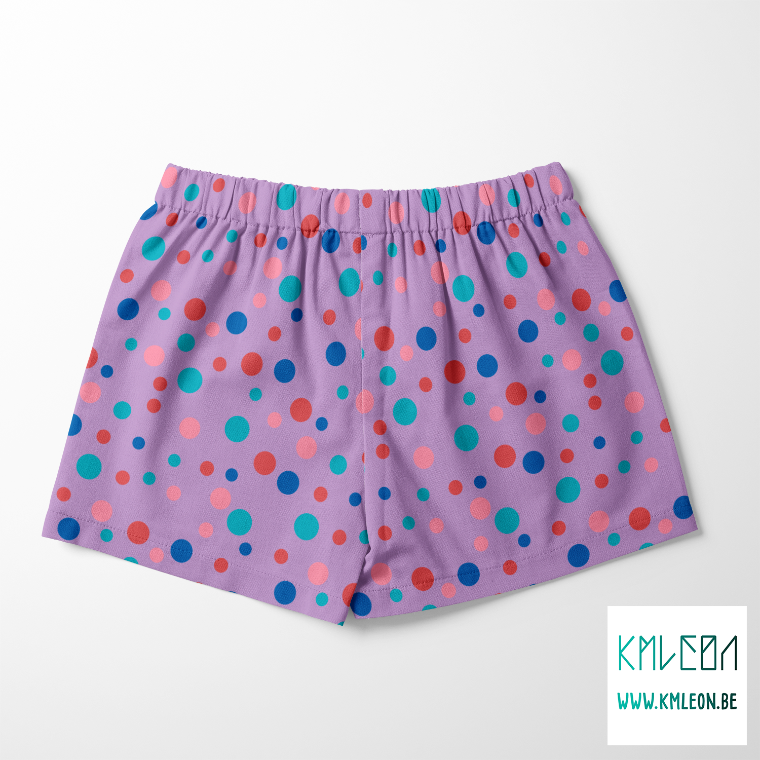 Random pink, red, blue and teal polka dots fabric