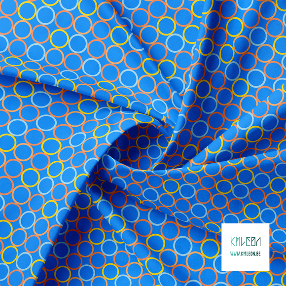 Random orange, blue and yellow circles fabric