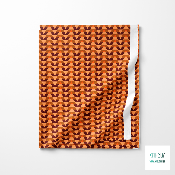 Striped triangles in beige, brown and orange fabric