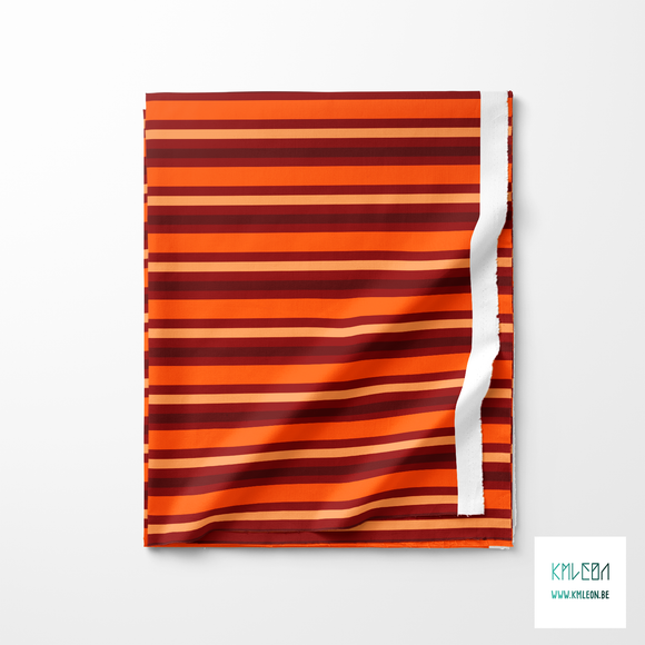 Horizontal stripes in orange, beige and brown fabric