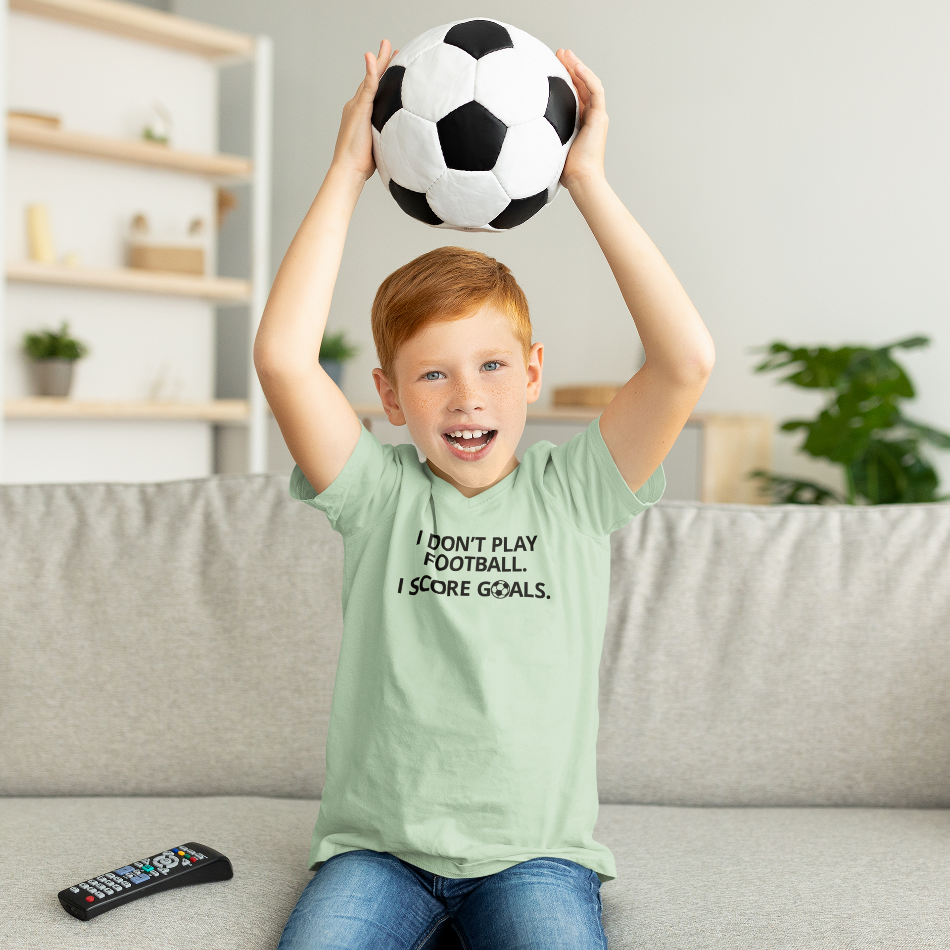 'I don't play football. I score goals.' kids shortsleeve shirt