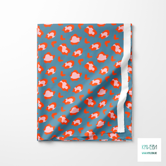 Pink and orange leopard print fabric