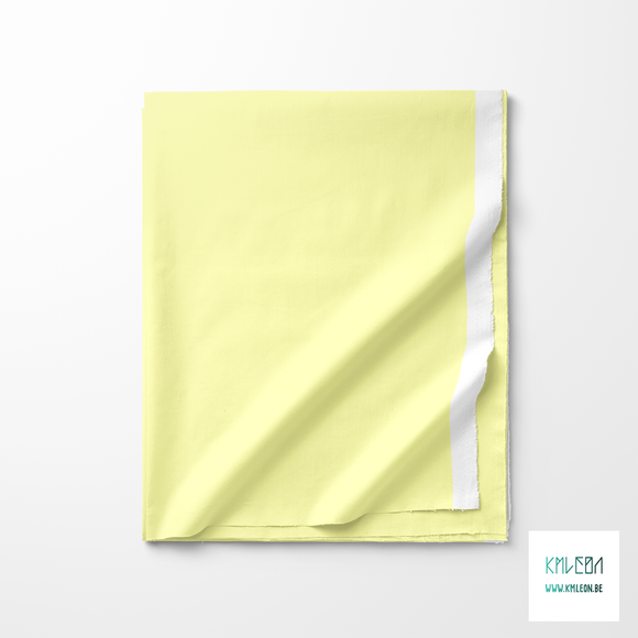 Solid pastel yellow fabric