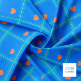 Blue and teal plaid with orange hearts fabric