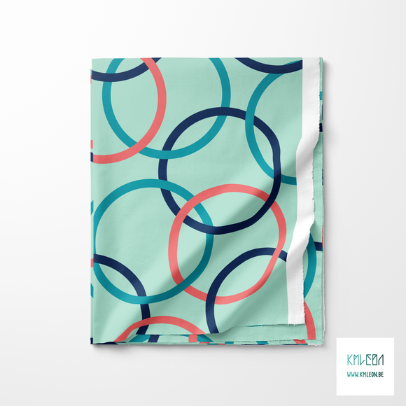 Pink, teal and navy interlocking rings fabric