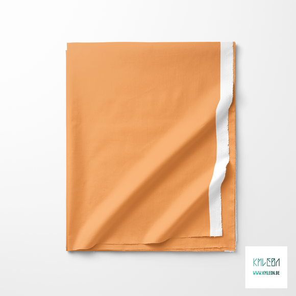 Solid sandy apricot fabric