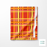 Yellow, orange, brown and pink tartan fabric