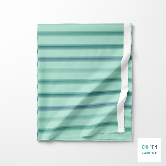 Soft horizontal stripes in green and blue fabric