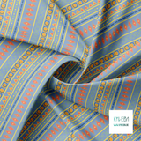 Geometric shapes in orange, blue, coral, yellow and green fabric