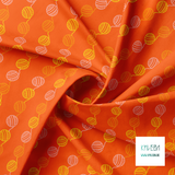 Yellow, orange and pink balls of yarn fabric
