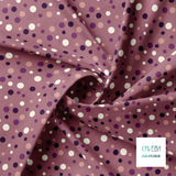 Random pink, purple and cream polka dots fabric