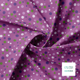 Random purple and green polka dots fabric