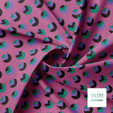 Purple, black and green circles and triangles fabric