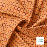 Random brown and orange circles fabric