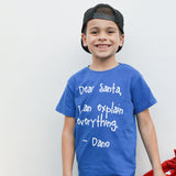Smiling boy with black cap and blue shirt with 'Santa, I can explain everything' shirt by KMLeon.