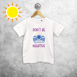 'Don't be negative' magic kids shortsleeve shirt