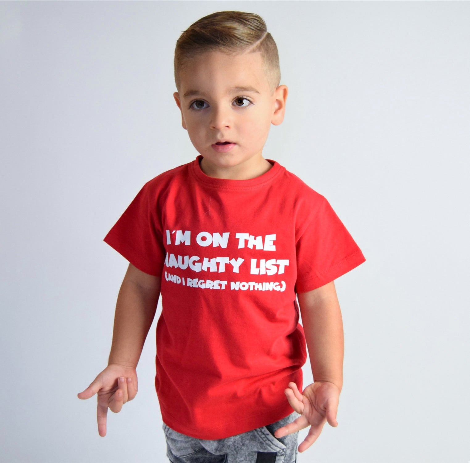 'I'm on the naughty list' kids shortsleeve shirt