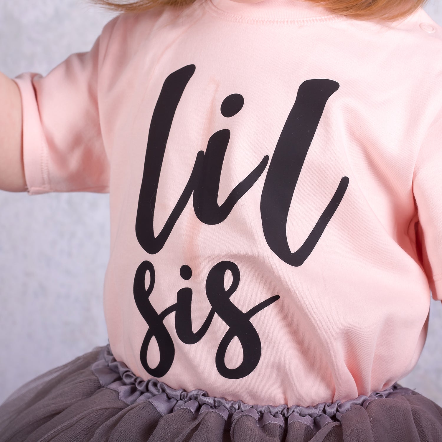 'Lil sis' baby shirt met korte mouwen