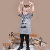 Blonde boy playing with snow, wearing heather grey shirt with 'Waiting for snow' print by KMLeon.