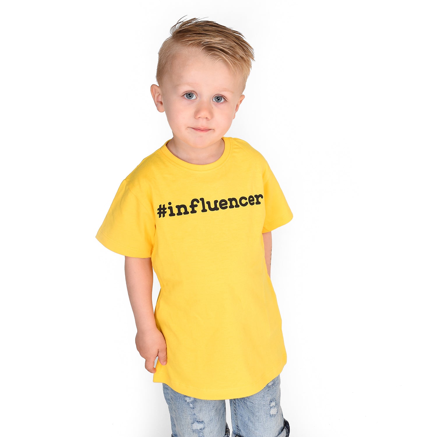 Blonde boy with yellow shirt, with '#influencer' print, by KMLeon.