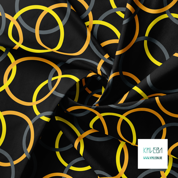 Grey, orange and yellow interlocking rings fabric