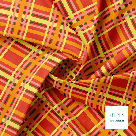Yellow, orange, brown and pink tartan fabric