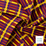 Yellow, blue, orange and purple tartan fabric