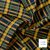 Grey, orange, yellow and black tartan fabric