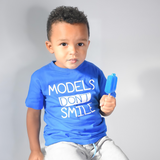 'Models don't smile' kids shortsleeve shirt