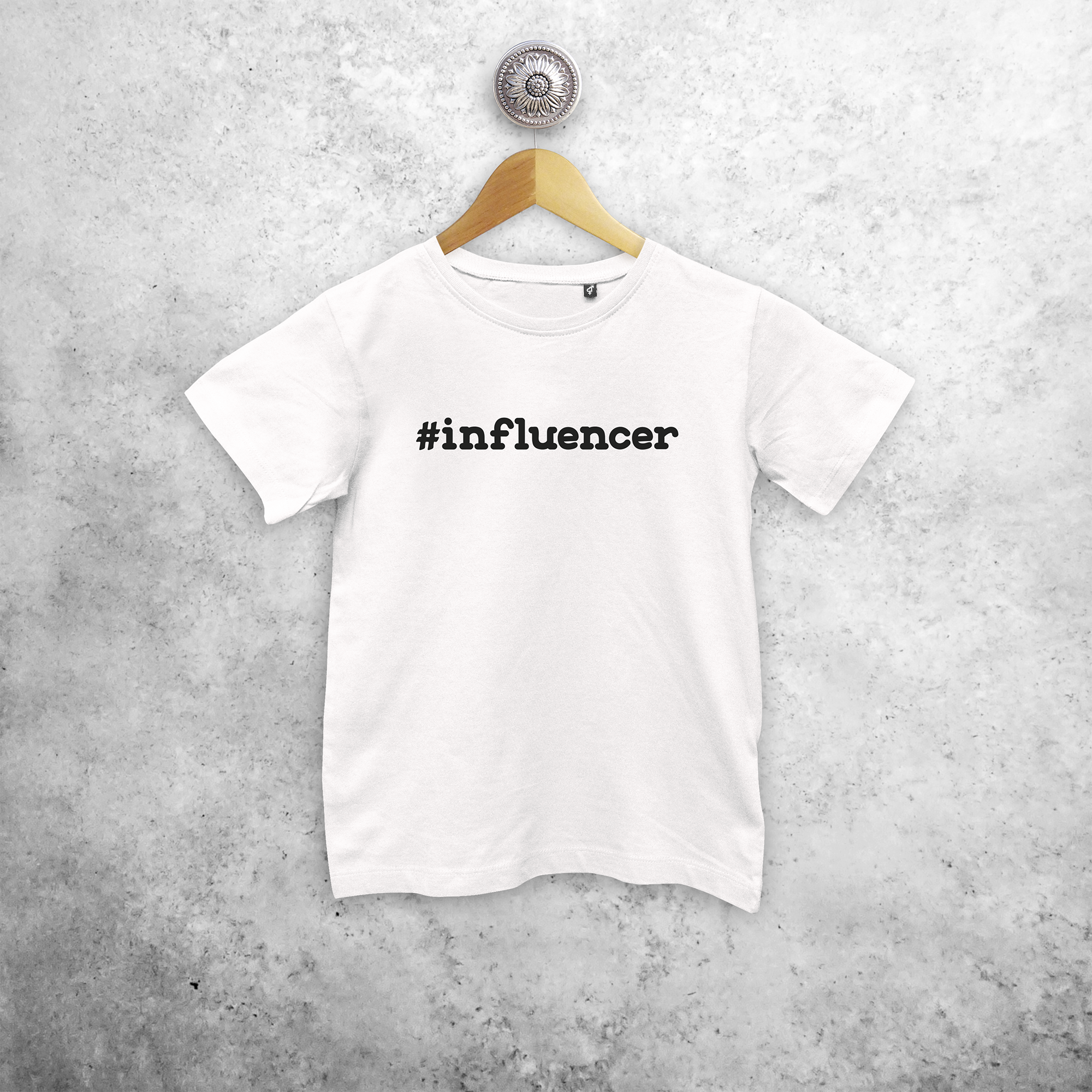 Kids shirt with short sleeves, with '#influencer' print by KMLeon.