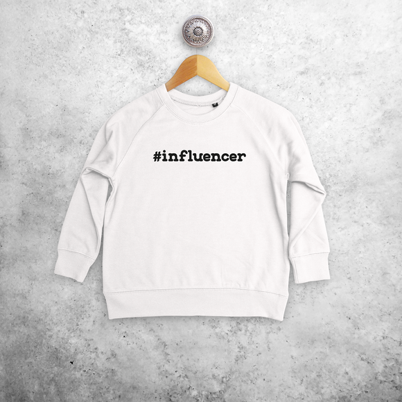Kids sweater, with '#influencer' print by KMLeon.