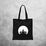 Castle and bats glow in the dark tote bag