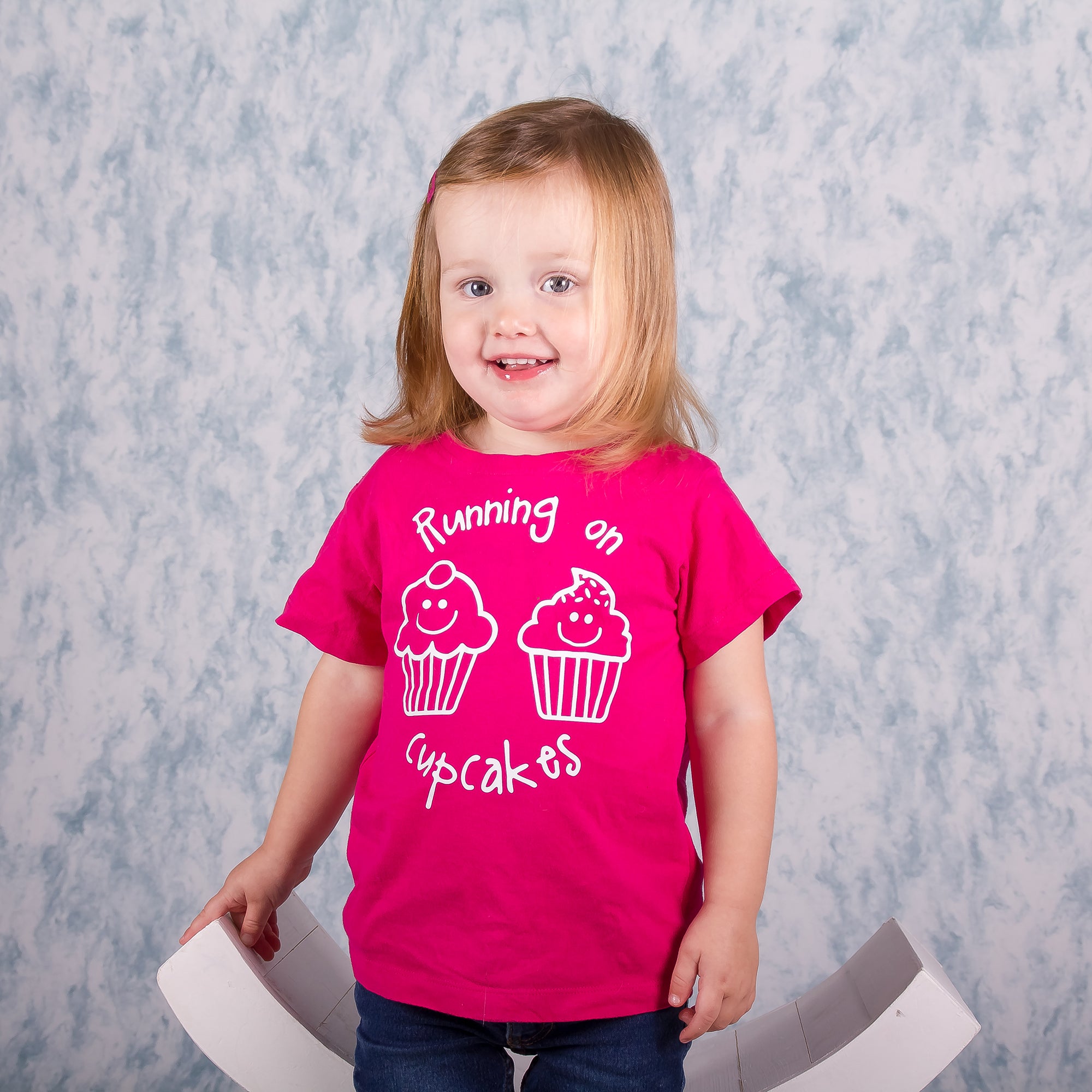 'Running on cupcakes' kids shortsleeve shirt