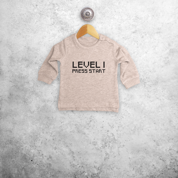 'Level... - Press start' baby sweater
