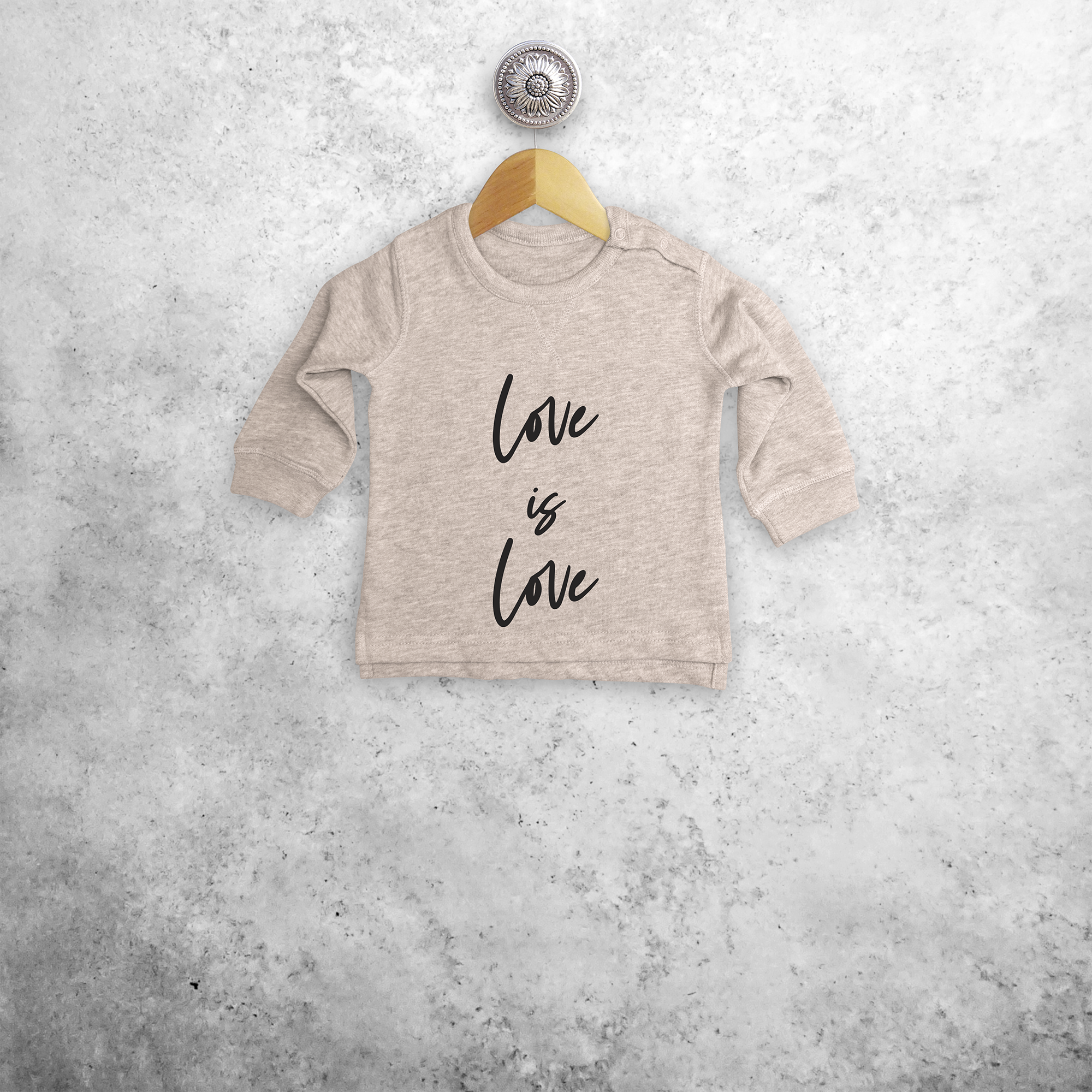 'Love is love' baby sweater