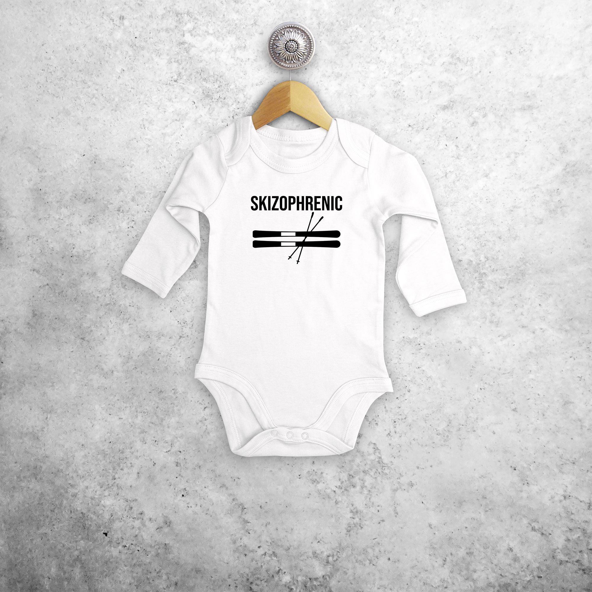 Baby or toddler bodysuit with long sleeves, with ‘Skizophrenic’ print by KMLeon.