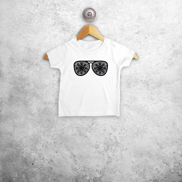 Baby or toddler shirt with short sleeves, with glitter snow star glasses print by KMLeon.