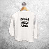 Kids shirt with long sleeves, with ‘Staching through the snow’ print by KMLeon.