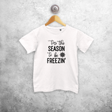 Kids shirt with short sleeves, with ‘‘tis the season to be freezin’’ print by KMLeon.