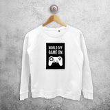 ‘World off – Game on’ sweater